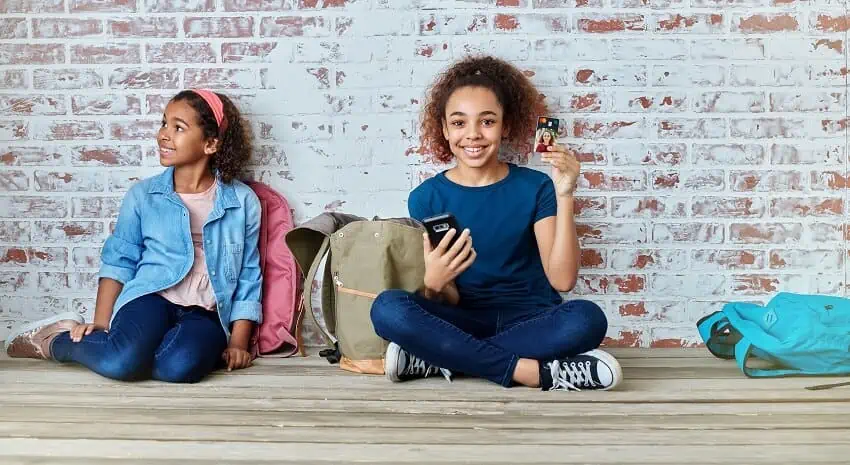 young girl with debit card
